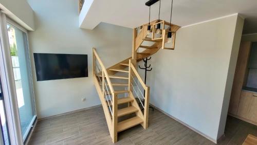 TV a/nebo společenská místnost v ubytování Apartamenty Róża Wiatrów