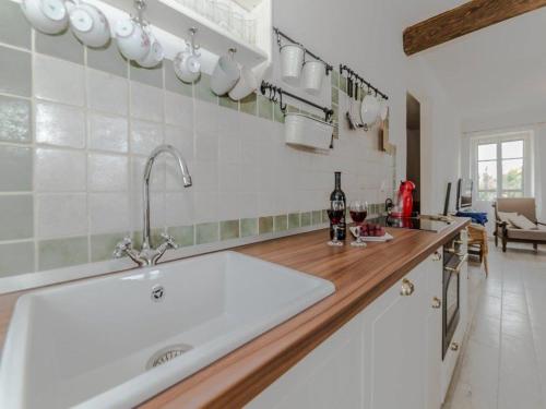 a kitchen with a sink and a counter with mugs at Antica holiday house with pool, sea view in Savar