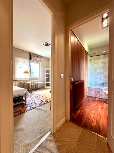 an open door to a room with a bedroom and a bed at Torre de las Águilas, Bellver, Puigcerdá in Bellver de Cerdanya 