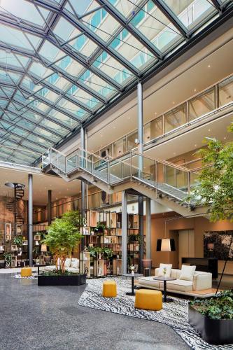 arium of a building with a staircase and furniture at NH Collection Heidelberg in Heidelberg