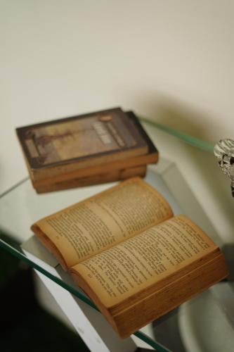 an open book on a glass table with at Social Safari Hostel, PARK STREET in Kolkata