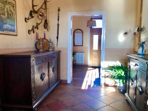 a room with a large wooden cabinet and a hallway at Amselwohnung in Lübs
