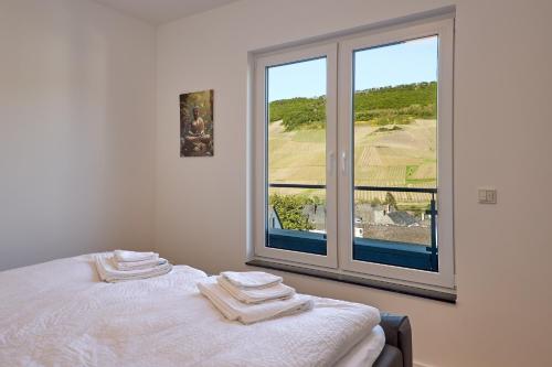 Ένα ή περισσότερα κρεβάτια σε δωμάτιο στο ZoHe Apartments Bernkastel-Kues