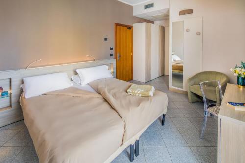 Postel nebo postele na pokoji v ubytování Hotel Gabriella