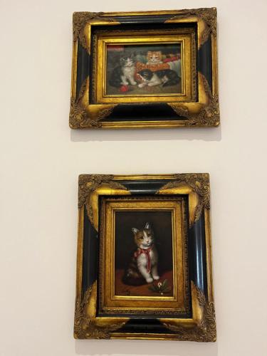 two framed paintings of a cat on a wall at West Colla Place in Schull