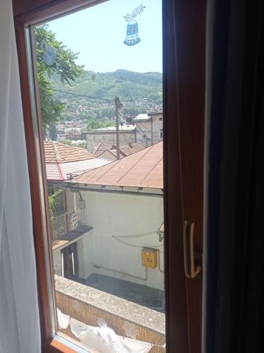 a view of a balcony from a window at ABAGuesthouse in Sarajevo