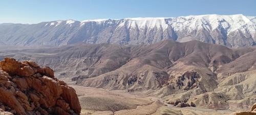 a view of a mountain range with snow covered mountains at Dar Essalama Dades in Akhendachou nʼAït Ouffi