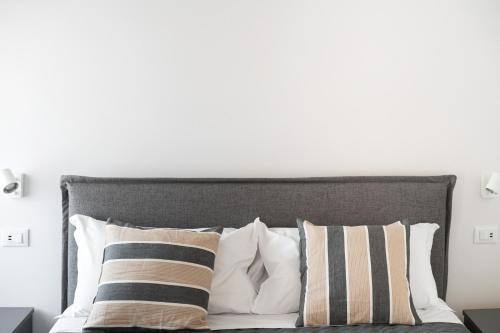 Katil atau katil-katil dalam bilik di Borgo Gemona Luxury Suites