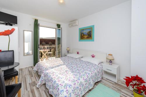Ένα ή περισσότερα κρεβάτια σε δωμάτιο στο Apartment Fiorenini