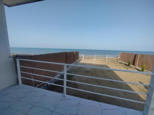 a view of the beach from the balcony of a house at Sahil Evi in Astara