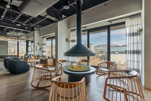 a room with a table and chairs and a large window at Modern Downtown High Rise Gym Free Pkg in Salt Lake City