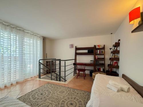 a bedroom with a bed and a table and chairs at Lydian Suite in Bari