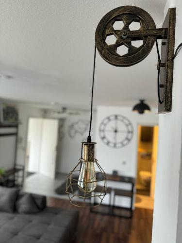 aendant light hanging in a living room at Usedom Suite Zeitlos - 100 Meter zum Strand in Ostseebad Koserow