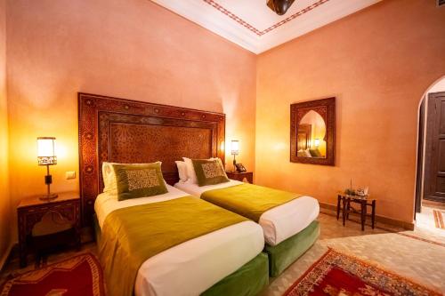 Una cama o camas en una habitación de Al Fassia Aguedal