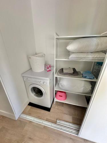 a laundry room with a washing machine and a washer at Apartment in city center - Garage - Beach 200 m in Berck-sur-Mer