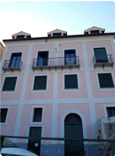 a large building with two balconies on top of it at La Mansarda 800metri da Ravello in Scala