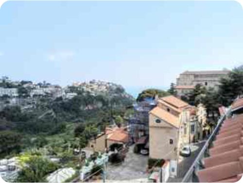 an overhead view of a city with buildings and trees at La Mansarda 800metri da Ravello in Scala