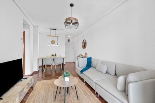 a living room with a couch and a table at Apartment With Lovely Views Los Altos Ciudad Quesada in Ciudad Quesada