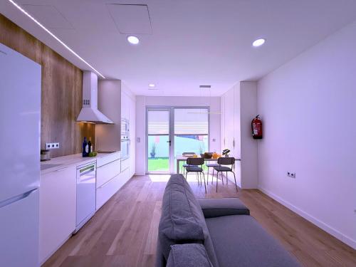 a living room with a couch and a table at San Francisco Central Suites Penthouse in Santa Cruz de Tenerife