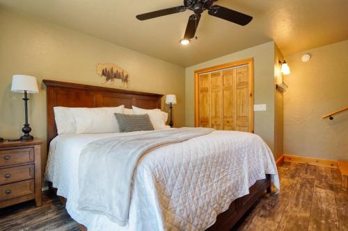 a bedroom with a bed and a ceiling fan at Ponderosa Cabin at Highland Meadows in Hot Springs
