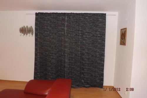 a window with a black curtain in a room at GME Easyflex Home-1 in Berlin