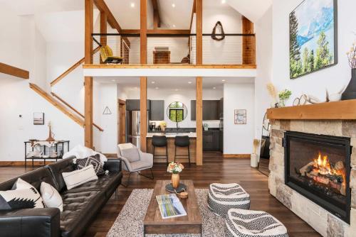 a living room with a couch and a fireplace at Upscale Ski Chalet - Wildlife AC Hot Tub in Driggs