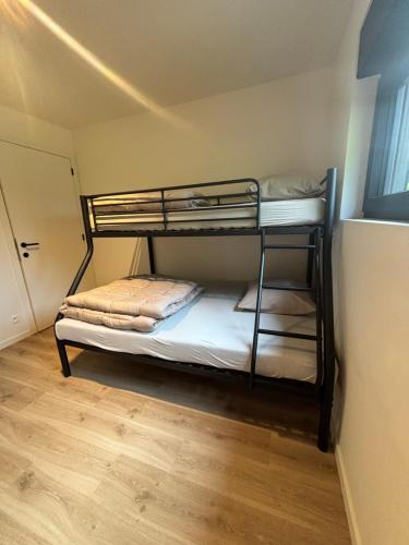 a bedroom with two bunk beds in a room at Home Terboekt in Genk