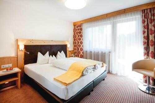 Postel nebo postele na pokoji v ubytování Hotel Bergblick 4 Sterne Superior