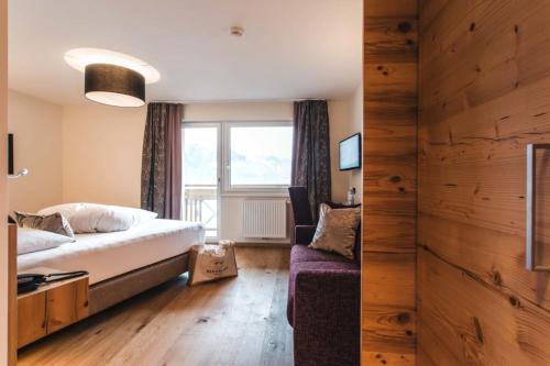 Postel nebo postele na pokoji v ubytování Hotel Bergblick 4 Sterne Superior