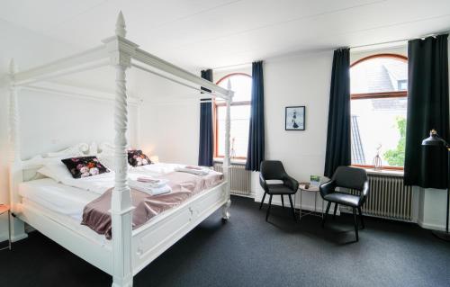 Postel nebo postele na pokoji v ubytování Hotel Phønix Brønderslev