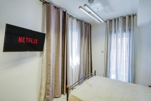 Ένα ή περισσότερα κρεβάτια σε δωμάτιο στο Central Aplotaria Apartment