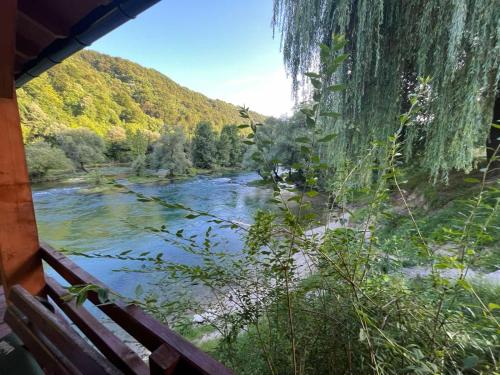 a view of a river from a window at Apartman Serdjo 