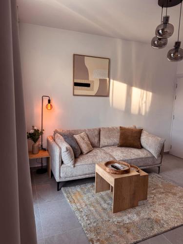 a living room with a couch and a coffee table at Cozy & Stylish 1Bedroom Apartment in Limassol