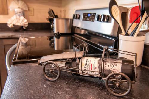 a small cart sitting on a counter in a kitchen at Away From It All By Avada Properties in Sevierville