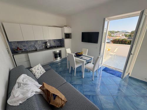 a living room with a couch and a table at Bellessere in vacanza Forio d’ Ischia in Forio d'Ischia