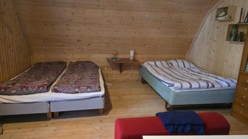 Postel nebo postele na pokoji v ubytování Vinds Våningen