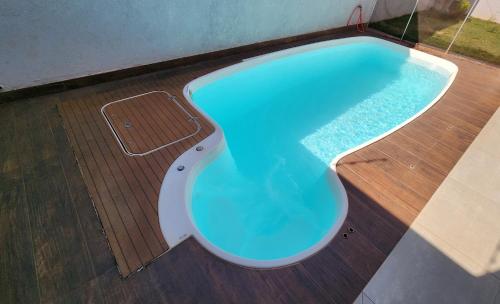 Kolam renang di atau dekat dengan Casa espaçosa, mesa de sinuca e piscina aquecida!