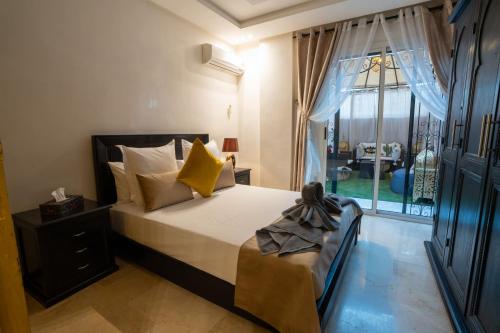 Postel nebo postele na pokoji v ubytování Gueliz family Express