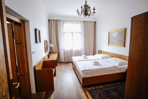 Postel nebo postele na pokoji v ubytování Hotel Šipka