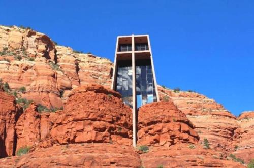 a clock tower in the middle of a mountain at Charming Sedona Stay with Community Spa & Pool in Sedona