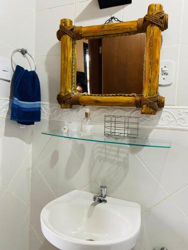 a bathroom with a sink and a mirror at Cantinho Pilar in Ouro Preto