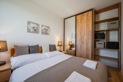 Postel nebo postele na pokoji v ubytování Residence Krušec
