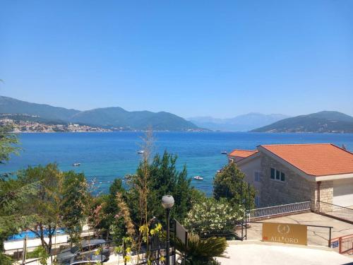 a view of a body of water with a building at Studio apartman Eden sea view in Njivice