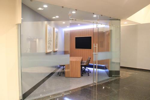 a conference room with a table and a television at Holiday Inn Mexico Dali Airport by IHG in Mexico City
