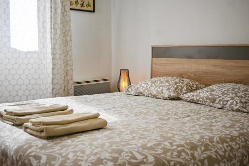 Ένα ή περισσότερα κρεβάτια σε δωμάτιο στο L'Osmose - Central & Cosy - Accès Tram Strasbourg - Commerces à Proximité