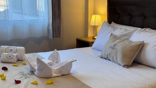 a hotel room with a bed with a stuffed animal on it at Andari Hoteles in Arequipa