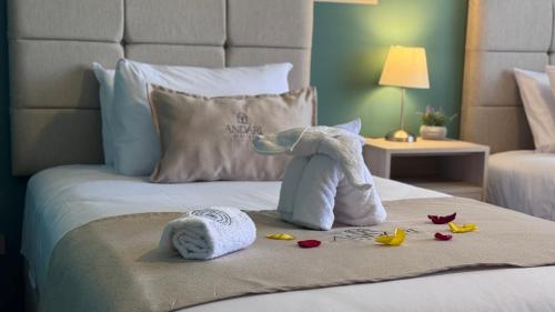 a stuffed elephant sitting on top of a bed at Andari Hoteles in Arequipa