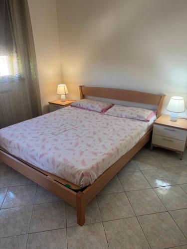 Postel nebo postele na pokoji v ubytování Angelina Apartment
