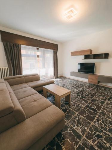 a living room with a couch and a table at Appartamenti Rivo Gelassa in Susa
