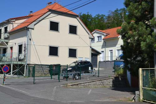 a car parked in front of a white house at Župky in Županovice